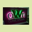 Световой короб с логотипом "oWn Clinic Studio"